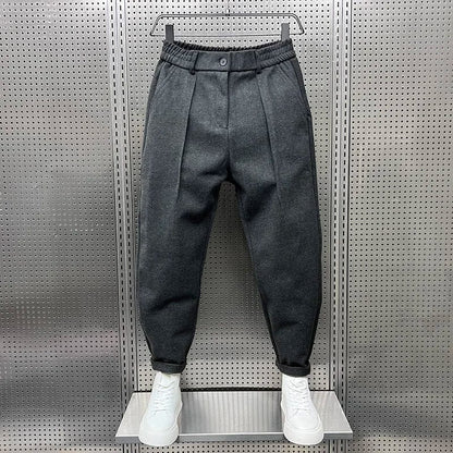 Men's Pleated Tapered Trousers with Belt Loops in Dark Gray – front view | Hensley London