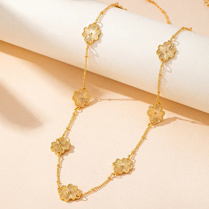 Women's Gold Floral Station Long Chain Necklace - View 3 | Hensley London