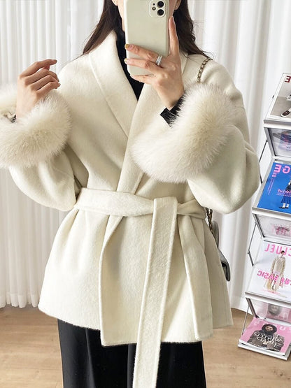 Women's Belted Shawl-Collar Coat with Textured Cuffs in Beige – front worn view | Hensley London