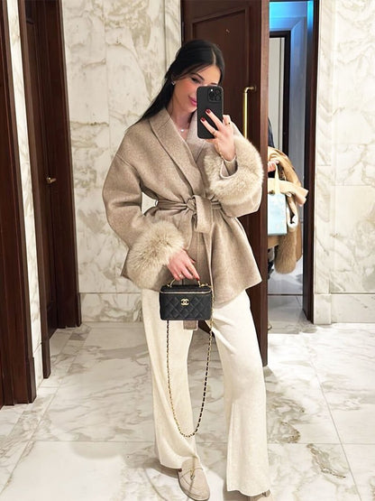 Women's Belted Shawl-Collar Coat with Textured Cuffs in Beige – front worn view | Hensley London