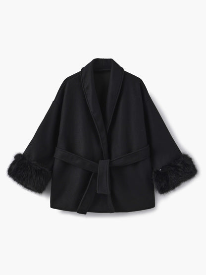 Women's Belted Shawl-Collar Coat with Textured Cuffs in Black – front product view | Hensley London