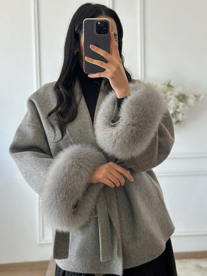 Women's Belted Shawl-Collar Coat with Textured Cuffs in Grey – front worn view | Hensley London