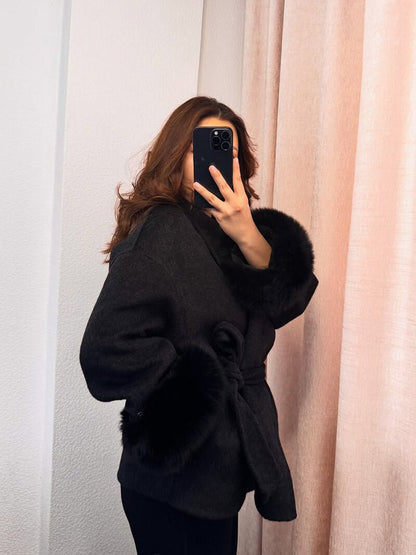 Women's Belted Shawl-Collar Coat with Textured Cuffs in Black – front worn view | Hensley London