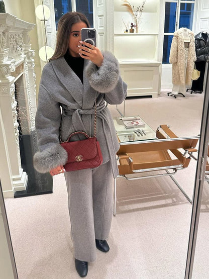Women's Belted Shawl-Collar Coat with Textured Cuffs in Grey – front worn view | Hensley London