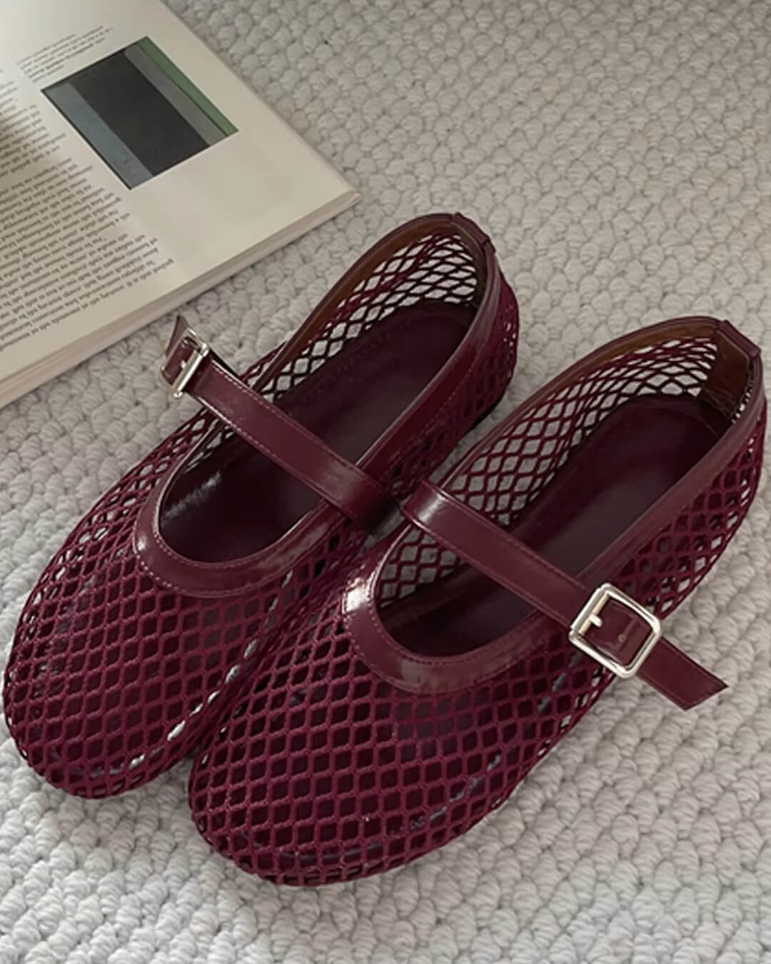 Women's Mesh Mary Jane Ballet Flats in Burgundy – pair on a textured surface | Hensley London